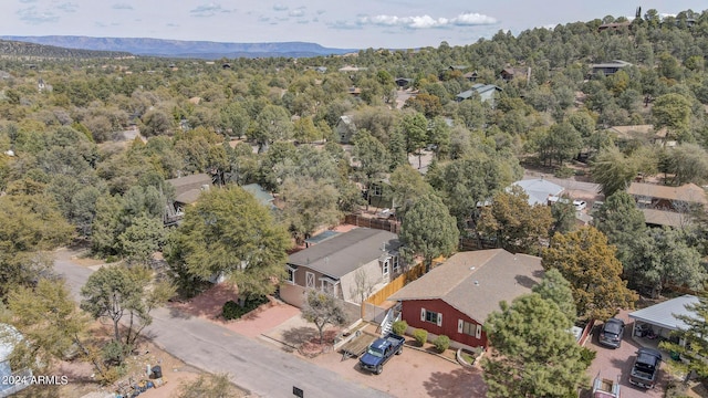 bird's eye view with a mountain view, a forest view, and a residential view