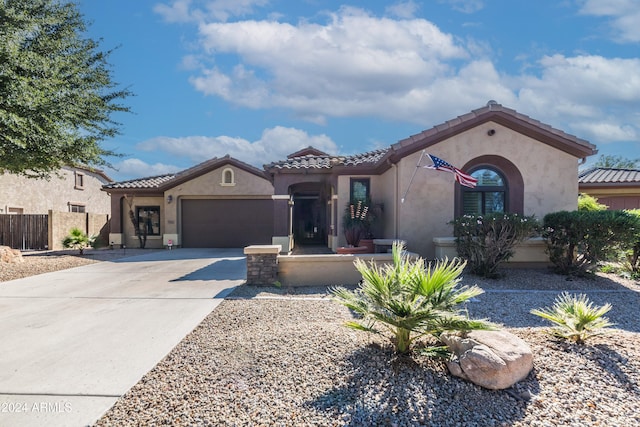 mediterranean / spanish-style home featuring a garage