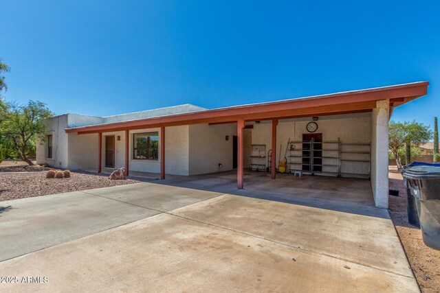 8043 E Laurel St, Mesa, AZ 85207 - view of front facade with stucco siding and an attached carport