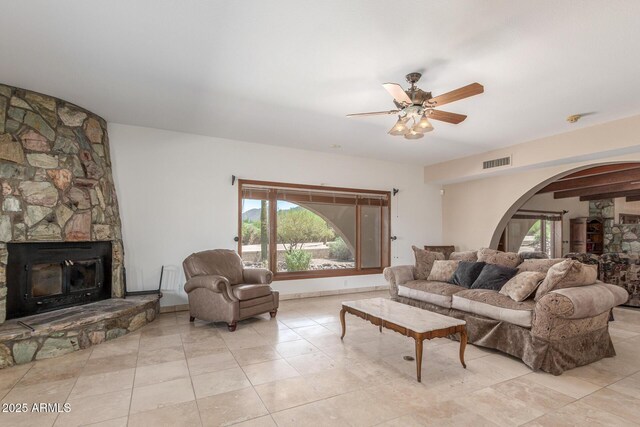 8043 E Laurel St, Mesa, AZ 85207 - living room featuring a fireplace, arched walkways, and plenty of natural light