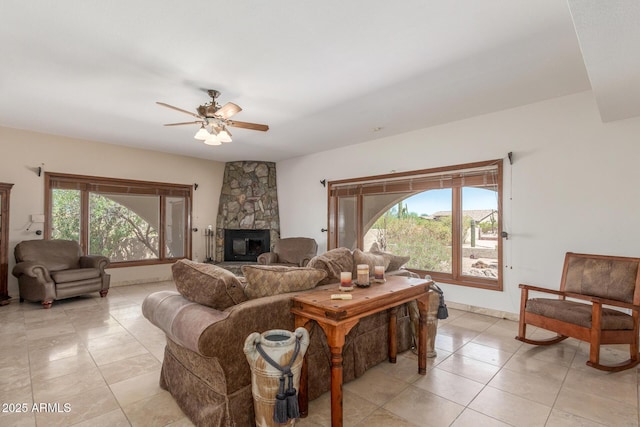 8043 E Laurel St, Mesa, AZ 85207 - living area featuring light tile patterned flooring, healthy amount of natural light, ceiling fan, and a fireplace