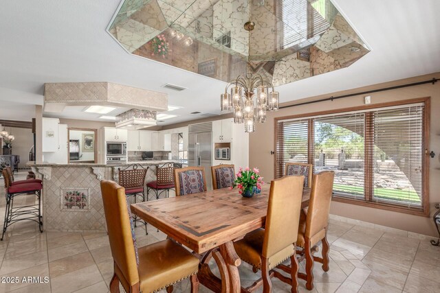 8043 E Laurel St, Mesa, AZ 85207 - dining area featuring a chandelier, light tile patterned floors, and a towering ceiling