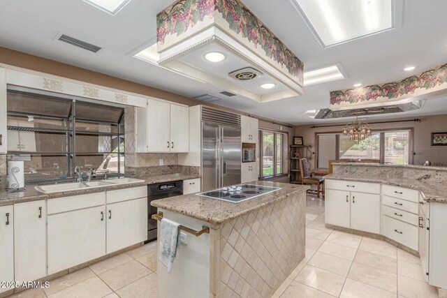 8043 E Laurel St, Mesa, AZ 85207 - kitchen featuring built in refrigerator, electric cooktop, dishwasher, light tile patterned flooring, and a kitchen island