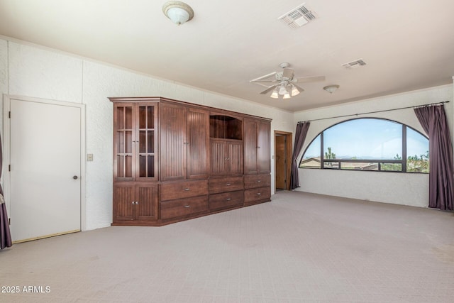 8043 E Laurel St, Mesa, AZ 85207 - unfurnished bedroom with light colored carpet, crown molding, a textured wall, and a ceiling fan