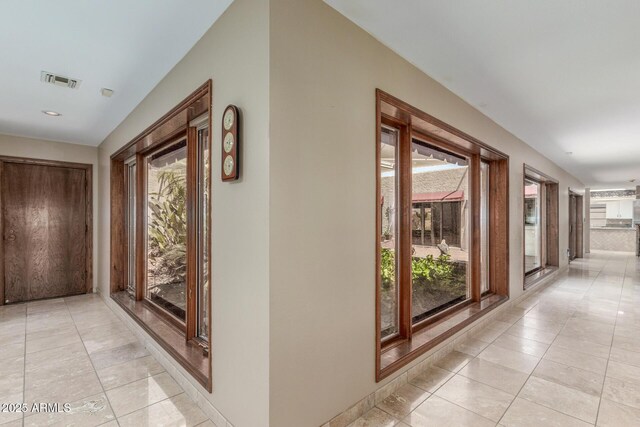 8043 E Laurel St, Mesa, AZ 85207 - hall featuring plenty of natural light, light tile patterned floors, and recessed lighting