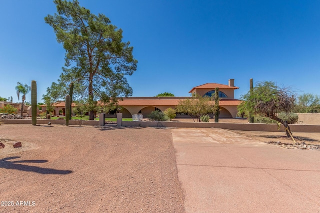 8043 E Laurel St, Mesa, AZ 85207 - view of front of house with stucco siding and a chimney