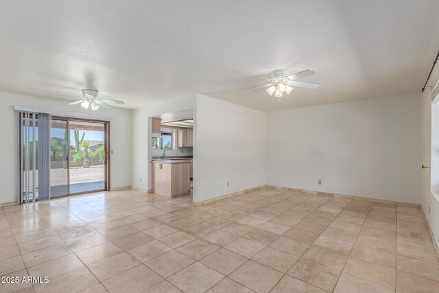 8043 E Laurel St, Mesa, AZ 85207 - unfurnished living room featuring a ceiling fan and light tile patterned floors
