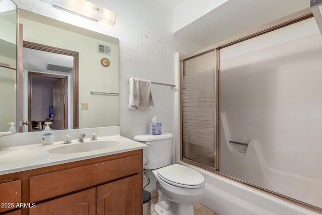 8043 E Laurel St, Mesa, AZ 85207 - full bathroom with vanity, bath / shower combo with glass door, and a textured wall