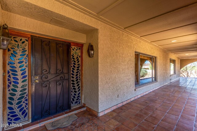 8043 E Laurel St, Mesa, AZ 85207 - doorway to property with stucco siding and covered porch