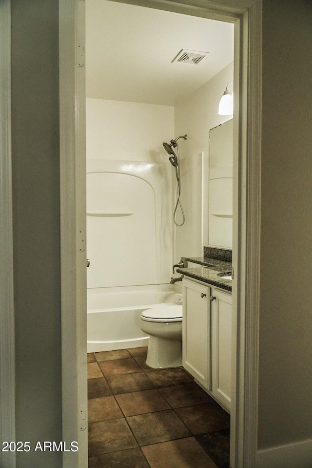 full bathroom with vanity, toilet, tile patterned flooring, and shower / bathing tub combination