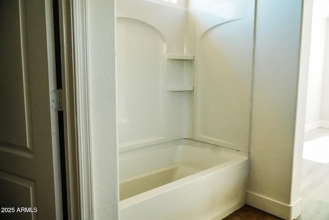 bathroom featuring shower / washtub combination