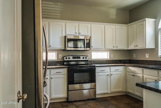 kitchen featuring white cabinets and appliances with stainless steel finishes