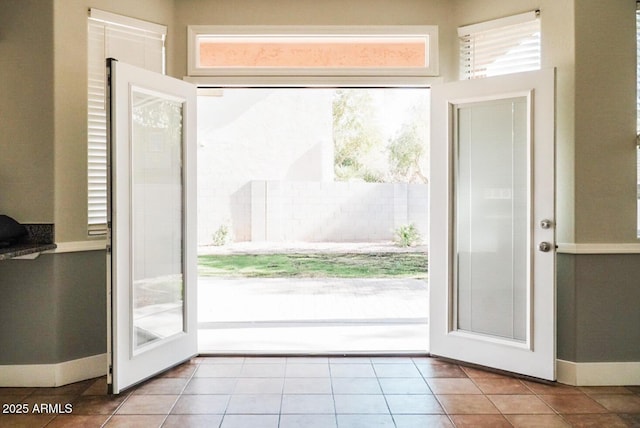 doorway to outside featuring light tile patterned floors