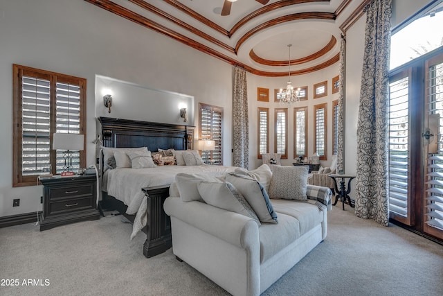 carpeted bedroom featuring ceiling fan with notable chandelier, a high ceiling, multiple windows, and ornamental molding