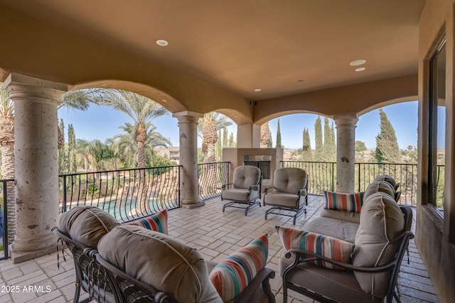 view of patio / terrace featuring an outdoor living space with a fireplace