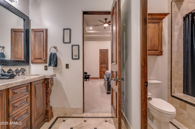 bathroom with ceiling fan, vanity, and toilet