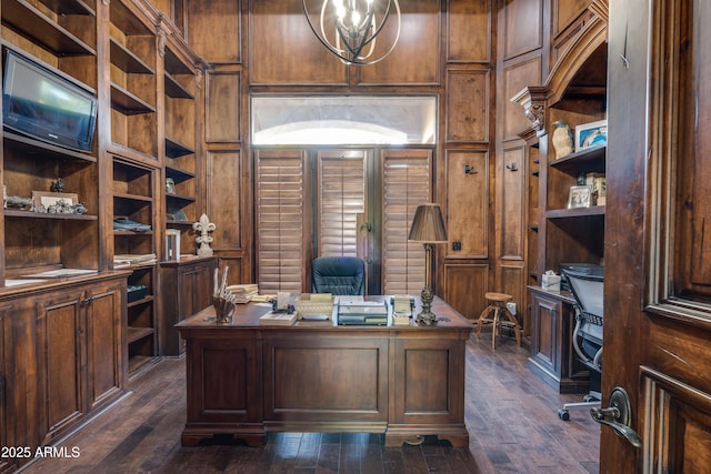 home office featuring dark hardwood / wood-style floors and a notable chandelier