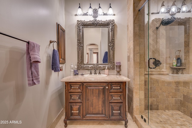 bathroom featuring walk in shower and vanity