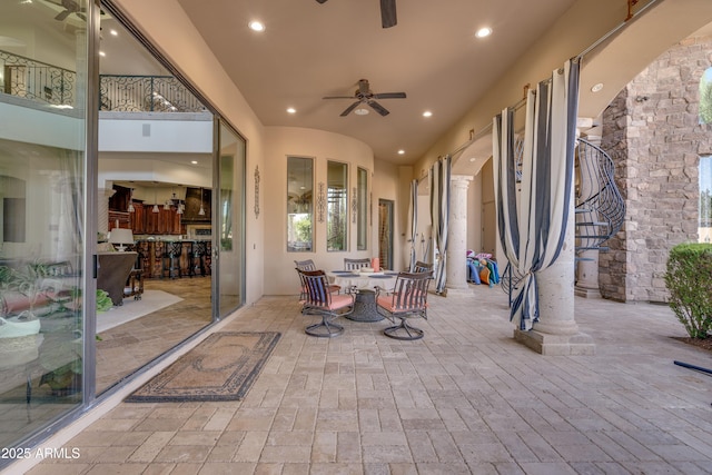 view of patio featuring ceiling fan