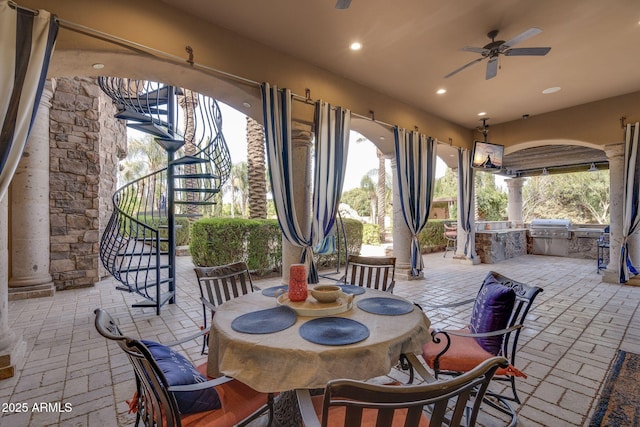 view of patio with ceiling fan, grilling area, and area for grilling