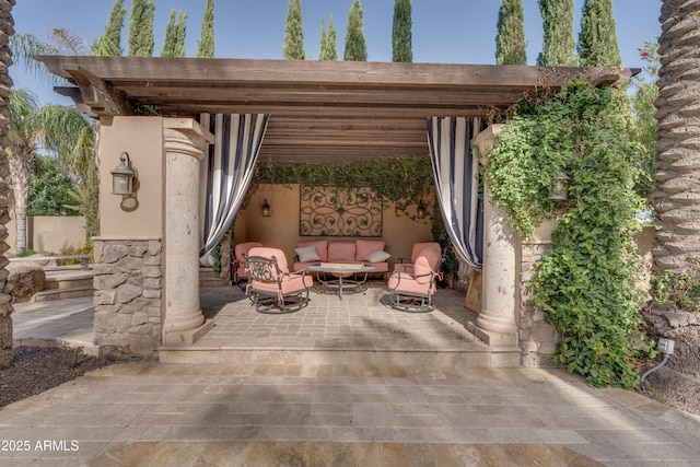 view of patio featuring an outdoor hangout area and a pergola