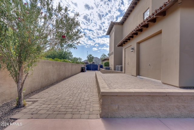 view of patio / terrace featuring a garage