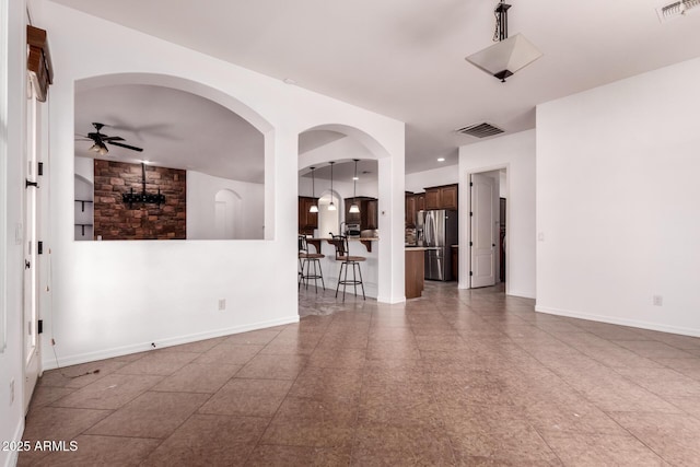 14552 S 182nd Dr, Goodyear, AZ 85338 - spare room with visible vents, a ceiling fan, and baseboards