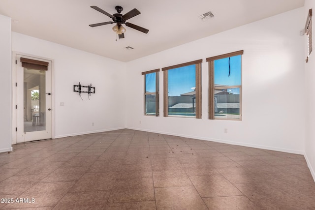 14552 S 182nd Dr, Goodyear, AZ 85338 - spare room featuring baseboards, plenty of natural light, ceiling fan, and visible vents