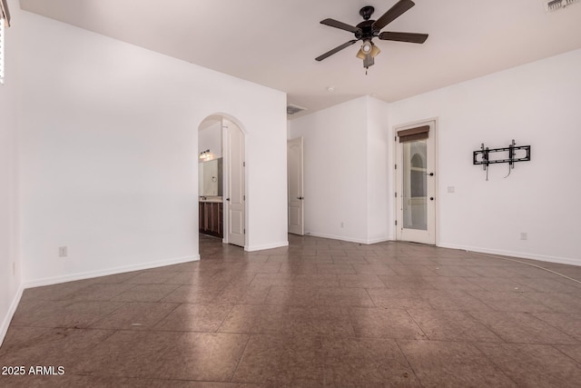14552 S 182nd Dr, Goodyear, AZ 85338 - unfurnished room featuring arched walkways, ceiling fan, and baseboards