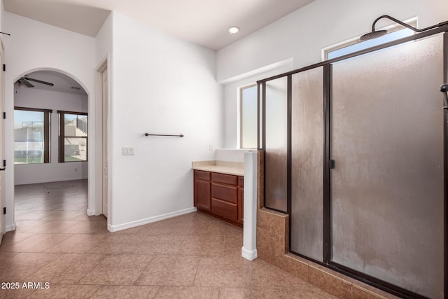14552 S 182nd Dr, Goodyear, AZ 85338 - bathroom with baseboards, a shower stall, tile patterned floors, and vanity