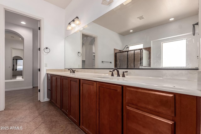 14552 S 182nd Dr, Goodyear, AZ 85338 - bathroom featuring a sink, tile patterned floors, a shower, and double vanity