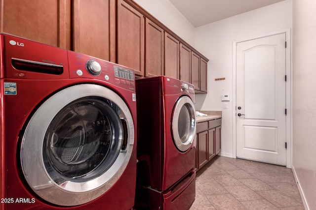 14552 S 182nd Dr, Goodyear, AZ 85338 - washroom with light tile patterned floors, separate washer and dryer, baseboards, and cabinet space