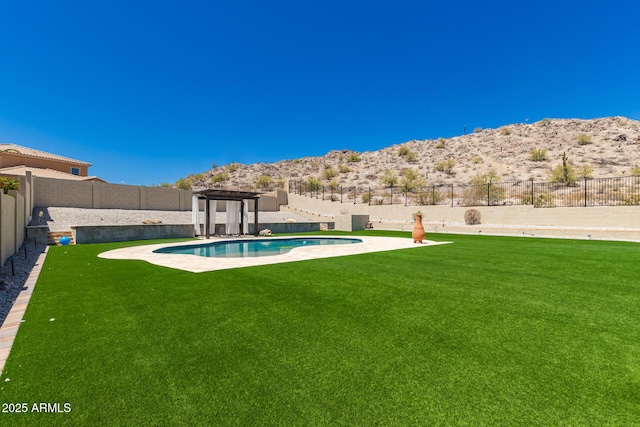 14552 S 182nd Dr, Goodyear, AZ 85338 - view of pool with a lawn, a fenced backyard, and a mountain view