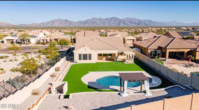 14552 S 182nd Dr, Goodyear, AZ 85338 - view of swimming pool featuring a fenced backyard, a mountain view, and a residential view