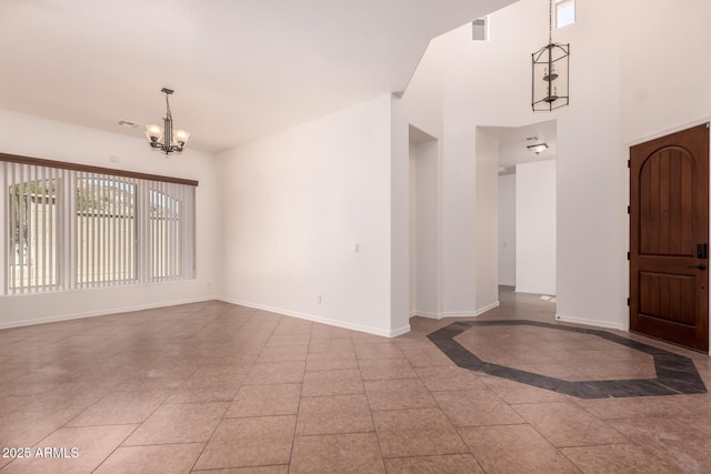 14552 S 182nd Dr, Goodyear, AZ 85338 - foyer featuring an inviting chandelier, baseboards, and a towering ceiling