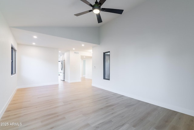 spare room with baseboards, light wood-type flooring, a ceiling fan, and recessed lighting