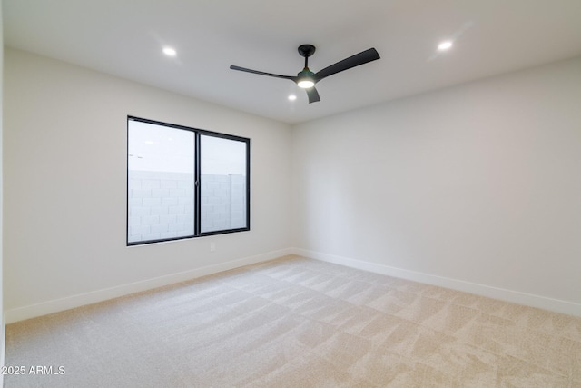 empty room featuring baseboards, ceiling fan, recessed lighting, and light colored carpet