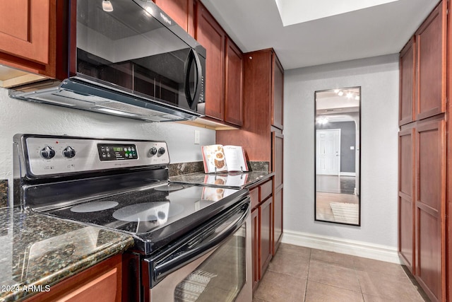 kitchen with light tile patterned floors and appliances with stainless steel finishes