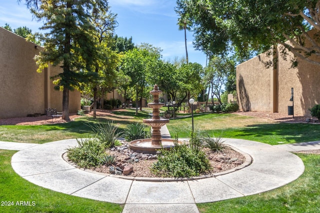 view of home's community featuring a lawn