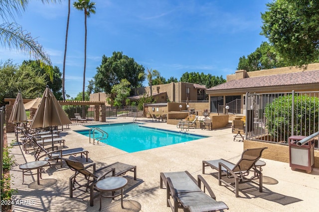 view of swimming pool with a patio area