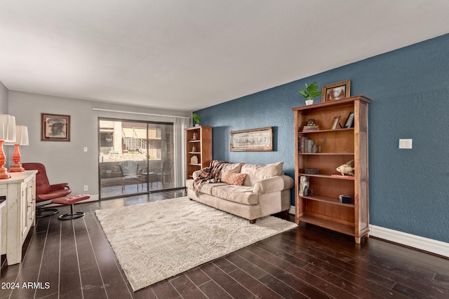 living room with dark hardwood / wood-style flooring