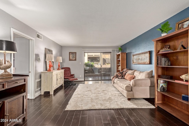 living room with dark hardwood / wood-style floors