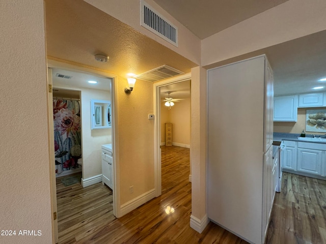 hall with dark hardwood / wood-style flooring