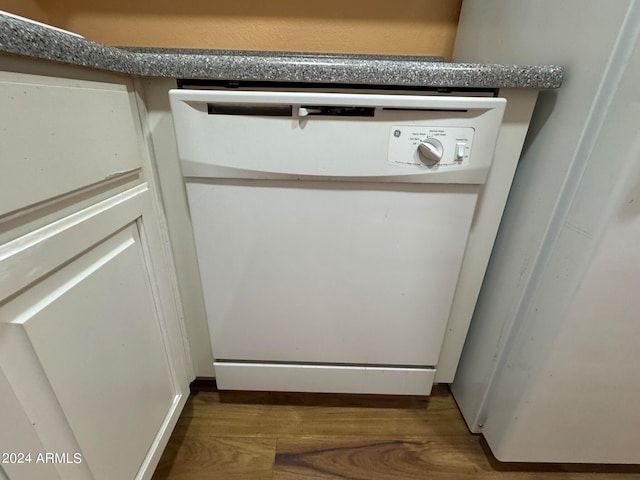 details featuring dishwasher and dark hardwood / wood-style flooring