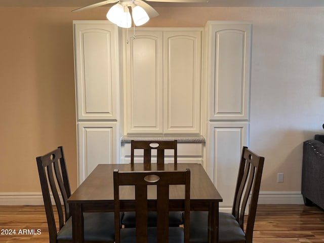 dining area featuring ceiling fan and hardwood / wood-style floors