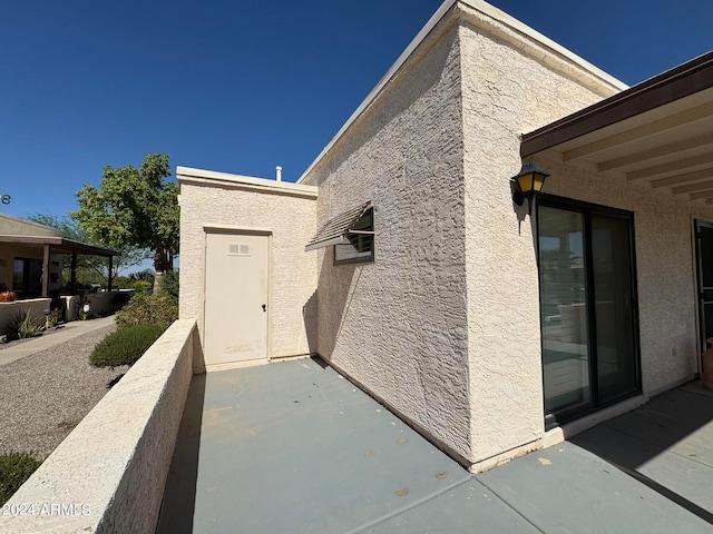 doorway to property with a patio