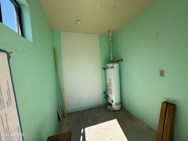 utility room with gas water heater