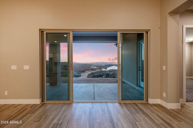 doorway to outside with hardwood / wood-style floors