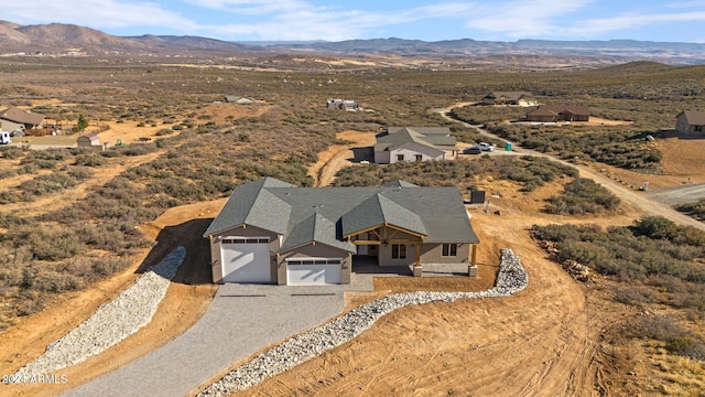 drone / aerial view featuring a mountain view