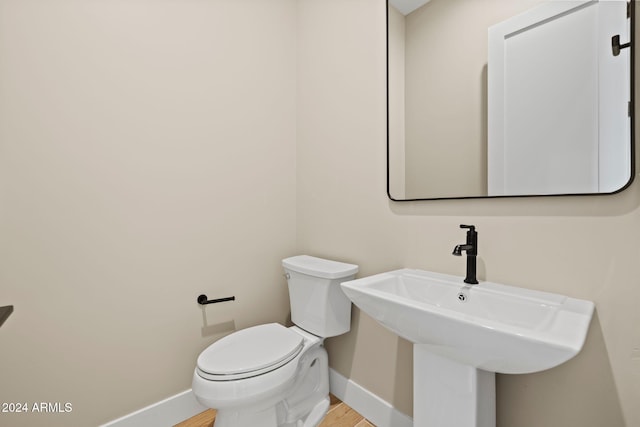 bathroom with toilet and sink